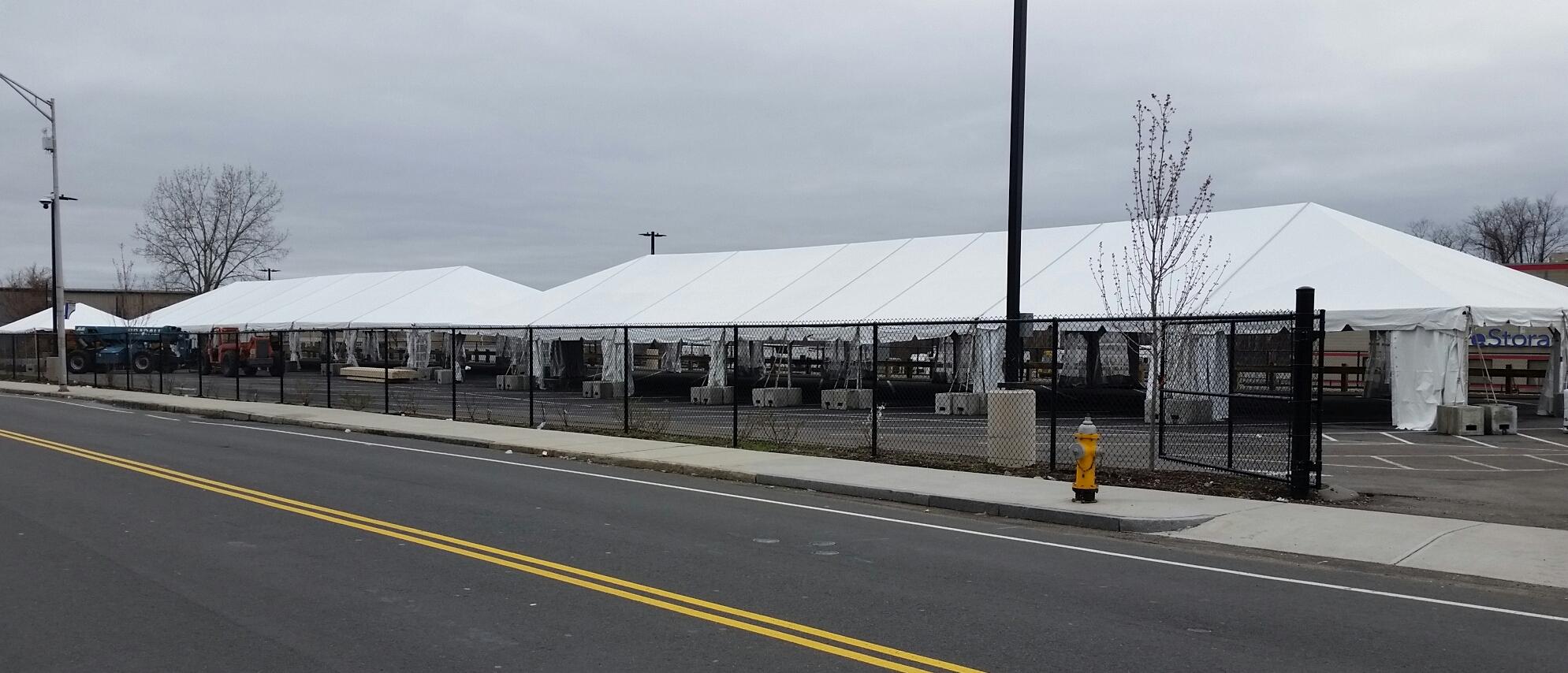 These tents in a parking lot across the street from the Friends Of the Homeless shelter in Springfield, MA will be used to test, quarantine, and treat homeless people during the pandemic.