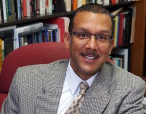 Dr. Lucas Morel smiles into the camera